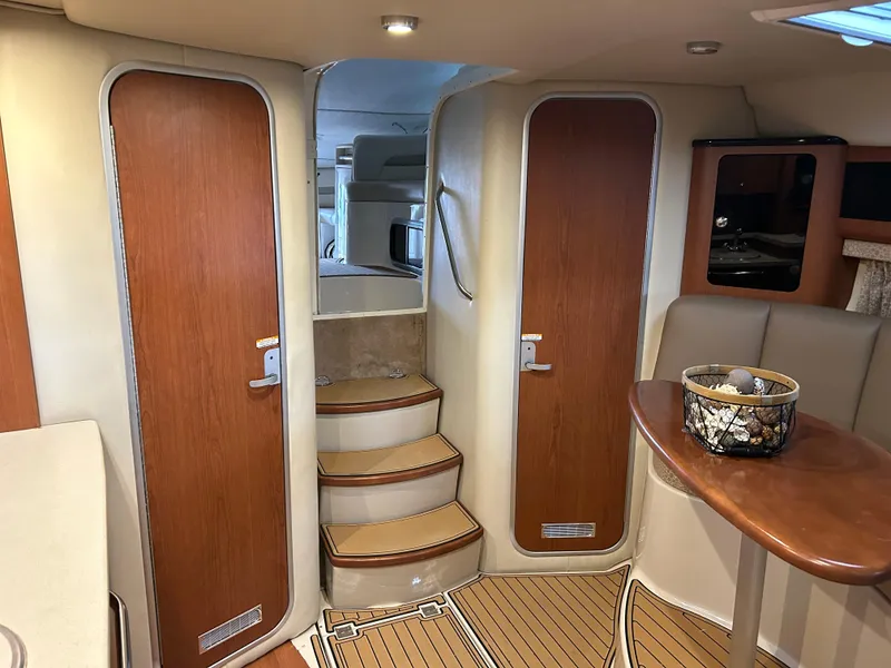 Slide: The Image of Interior of 2003 Chaparral 330 Signature Cruiser with wooden doors and steps. - 19