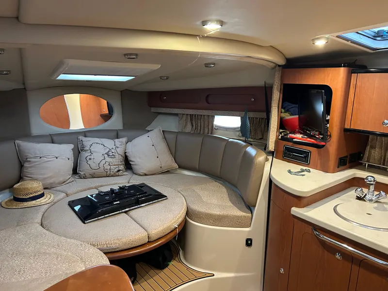 Slide: The Image of Interior of 2003 Chaparral 330 Signature Cruiser with cozy seating and modern amenities. - 21