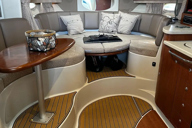 Slide: The Image of Interior of 2003 Chaparral 330 Signature Cruiser with elegant seating and wooden flooring. - 30