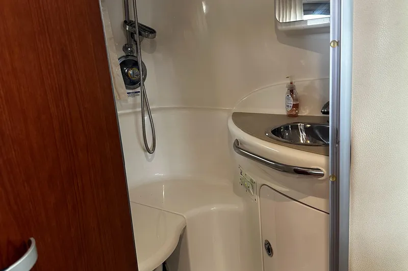 Slide: The Image of 2003 Chaparral 330 Signature Cruiser bathroom with sink and shower. - 31