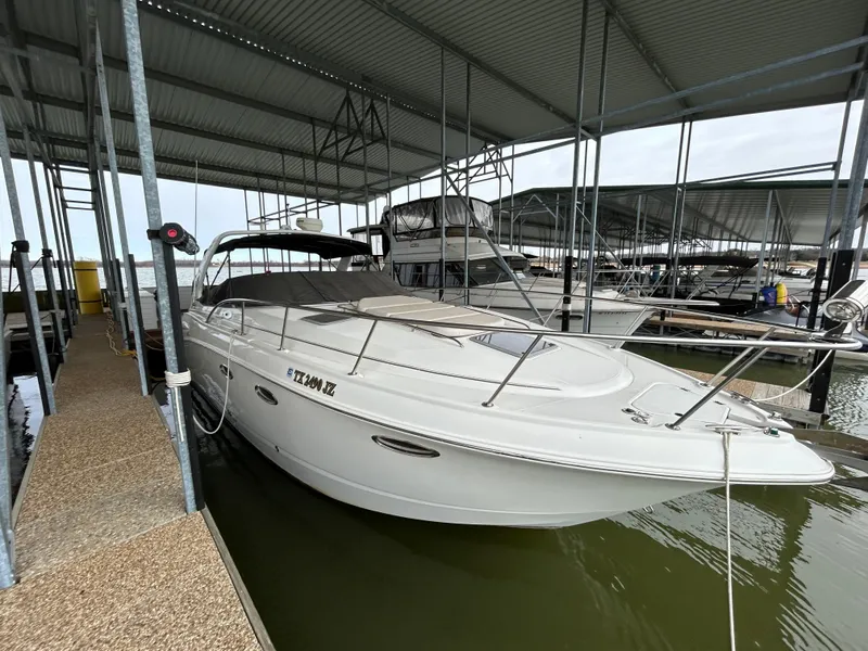 Slide: The Image of 2003 Chaparral 330 Signature Cruiser docked in a covered marina. - 5