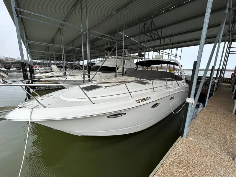 Slide: The Image of 2003 Chaparral 330 Signature Cruiser docked in a covered marina. - 7