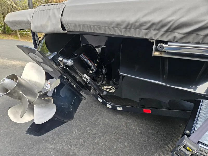 Slide: The Image of 2013 Sea Ray 230 SLX boat stern with propeller and cover. - 22