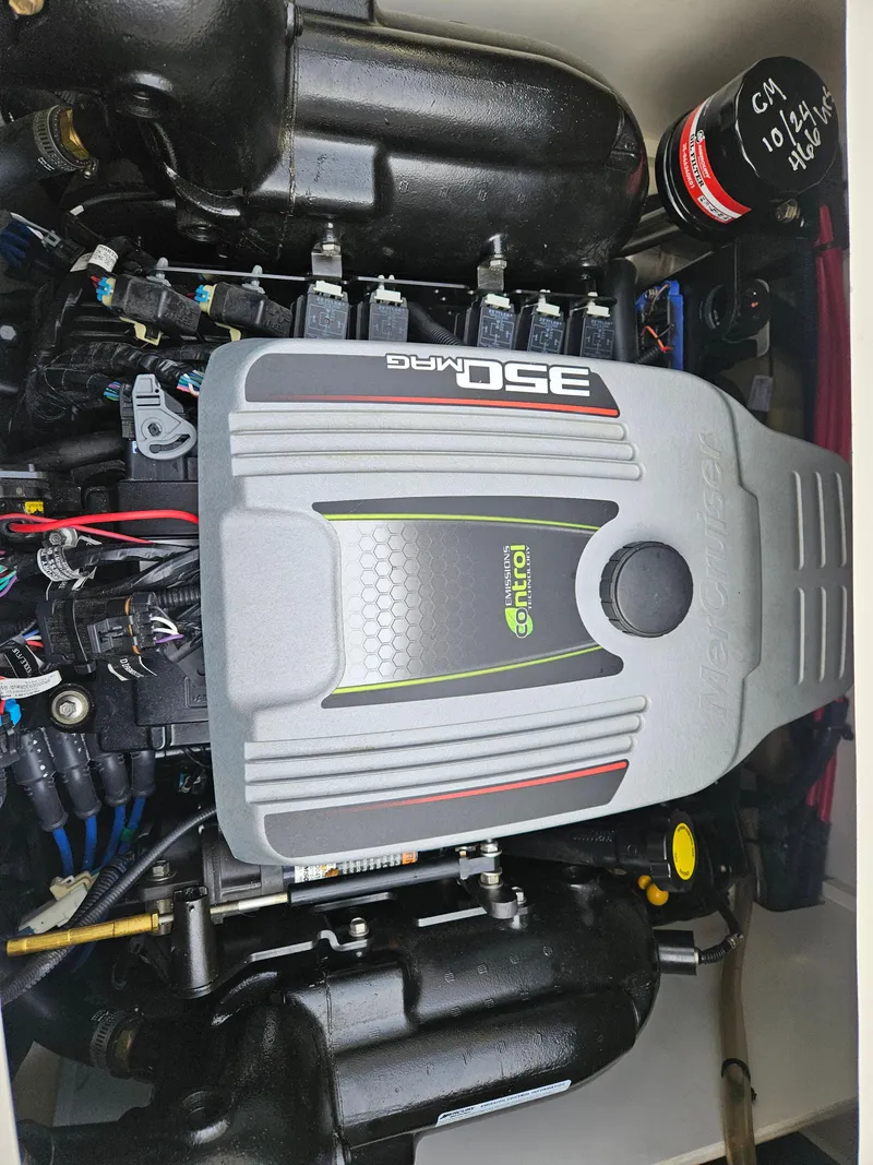 Slide: The Image of 2013 Sea Ray 230 SLX engine compartment with 350 MAG engine. - 26