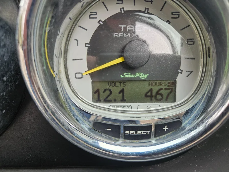 Slide: The Image of Tachometer of 2013 Sea Ray 230 SLX showing 12.1 volts and 467 hours. - 27