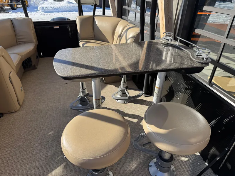 Slide: The Image of Interior of 2019 Godfrey Premium 235SD Sundeck with seating and table. - 11