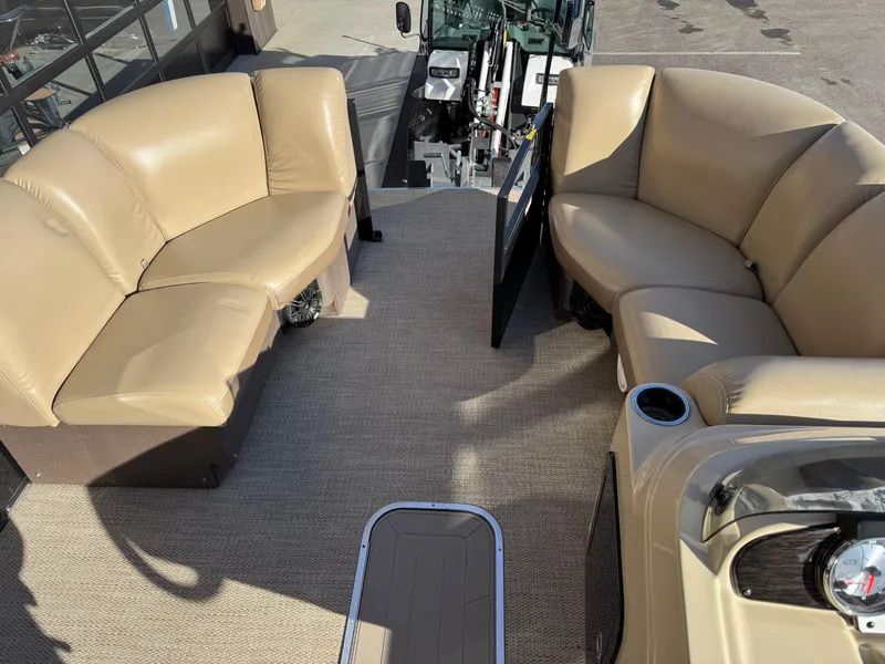 Slide: The Image of Interior of 2019 Godfrey Premium 235SD Sundeck with beige seating and carpeted floor. - 13