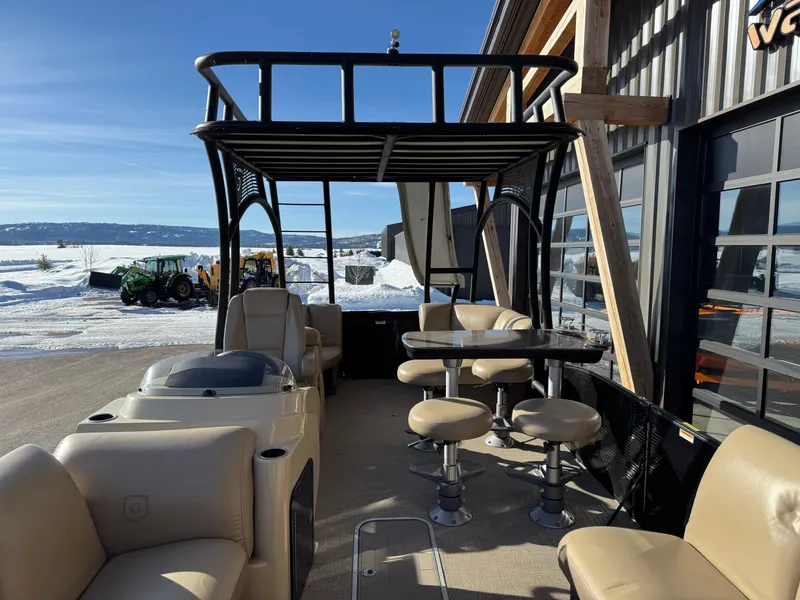 Slide: The Image of 2019 Godfrey Premium 235SD Sundeck boat with seating, docked in snowy landscape. - 14