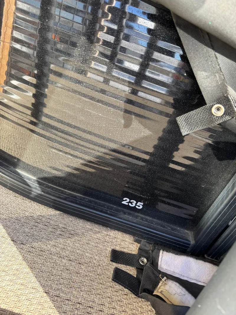 Slide: The Image of Close-up of 2019 Godfrey Premium 235SD Sundeck interior with visible "235" marking. - 17