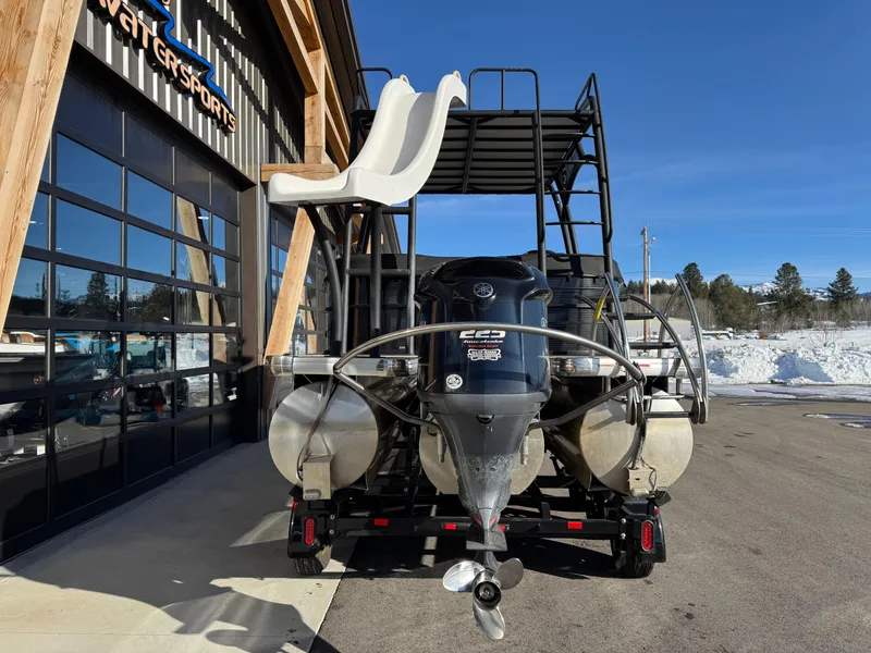 Slide: The Image of 2019 Godfrey Premium 235SD Sundeck boat with slide, parked outside a watersports facility. - 4