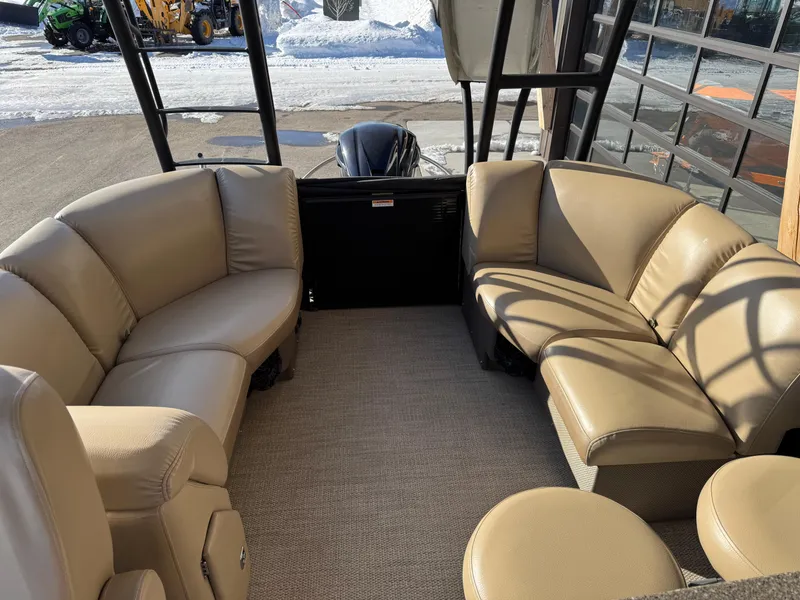 Slide: The Image of 2019 Godfrey Premium 235SD Sundeck interior with beige seating and carpeted floor. - 8