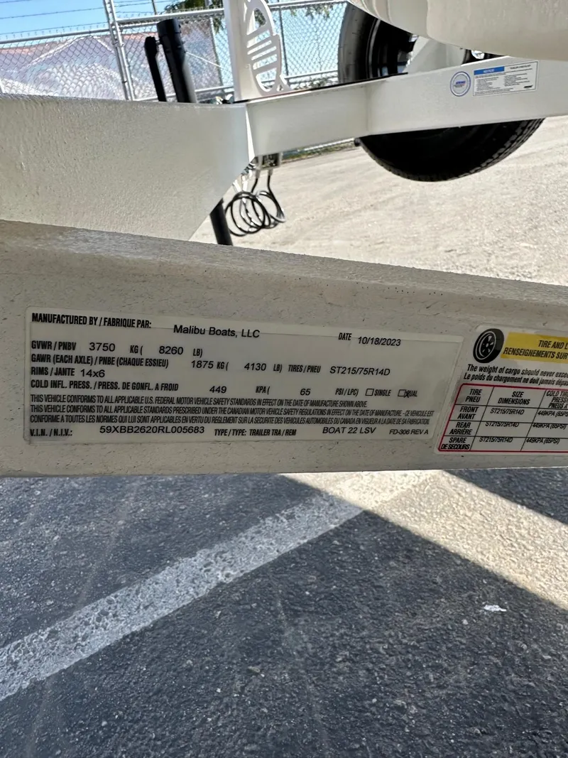 Slide: The Image of Label on 2024 Malibu 22 LSV boat trailer, showing specifications and manufacturing details. - 22