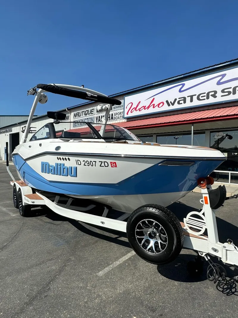 Slide: The Image of 2024 Malibu 22 LSV boat on trailer at Idaho Water Sports dealership. - 3