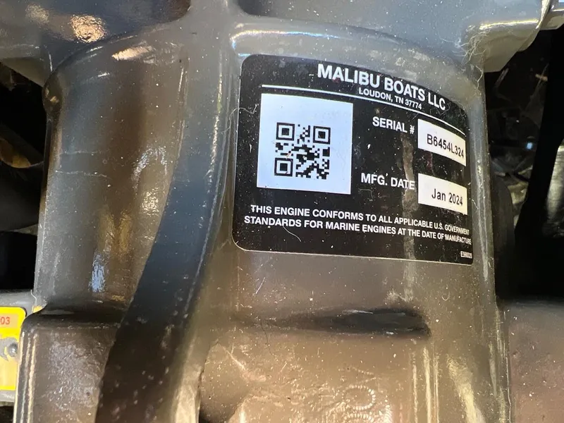 Slide: The Image of 2024 Malibu 23 LSV engine label with serial number and manufacturing date. - 21