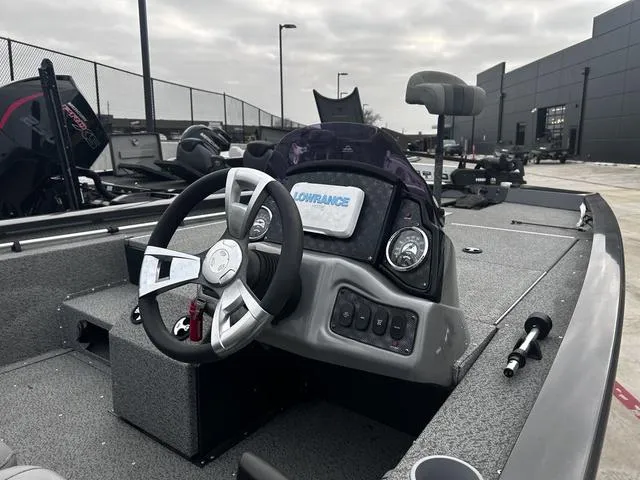 Slide: The Image of 2022 G3 Sportsman 1910 boat interior with steering wheel and Lowrance display. - 4