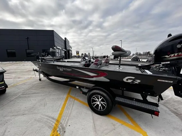 Slide: The Image of 2022 G3 Sportsman 1910 boat parked outdoors on a cloudy day. - 7