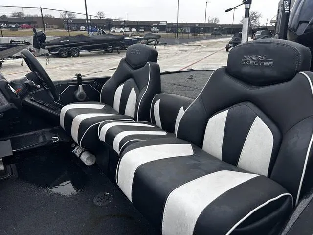 Slide: The Image of 2020 Skeeter ZX225 boat interior with black and white seats. - 3