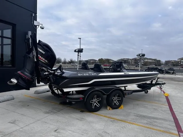 Slide: The Image of 2020 Skeeter ZX225 boat on trailer, parked outdoors, featuring Yamaha outboard motor. - 5