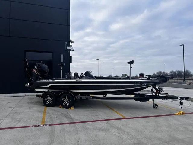 Slide: The Image of 2020 Skeeter ZX225 boat parked outdoors on a trailer. - 6