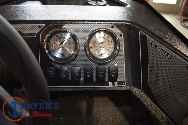 Slide: The Image of Dashboard of 2025 Lund 1650 Rebel XL SS boat with gauges and controls. - 22