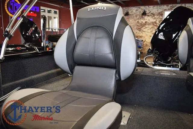 Slide: The Image of 2025 Lund 1650 Rebel XL SS boat interior with comfortable seating at Thayer's Marine. - 26