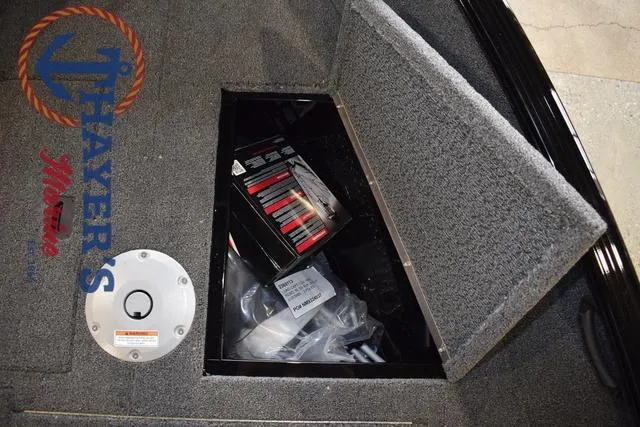 Slide: The Image of Storage compartment in 2025 Lund 1650 Rebel XL SS boat with equipment inside. - 28