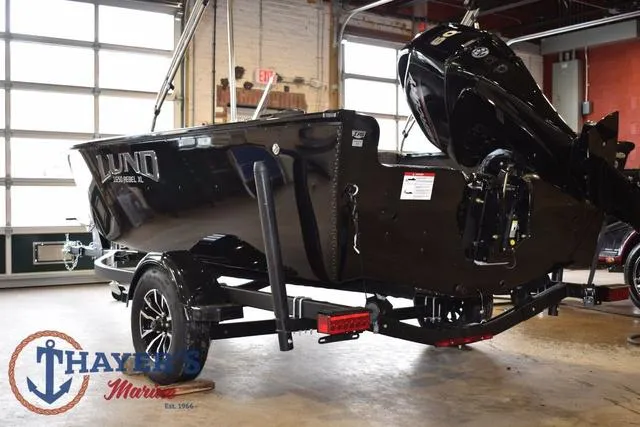 Slide: The Image of 2025 Lund 1650 Rebel XL SS boat on trailer in showroom. - 5