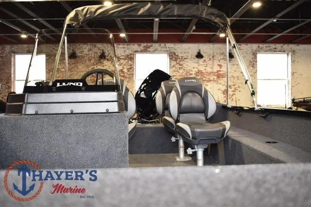 Slide: The Image of 2025 Lund 1650 Rebel XL SS boat interior at Thayer's Marine showroom. - 9