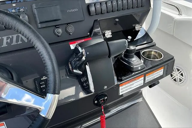 Slide: The Image of 2025 Blackfin 272CC boat dashboard with steering wheel and control panel. - 12