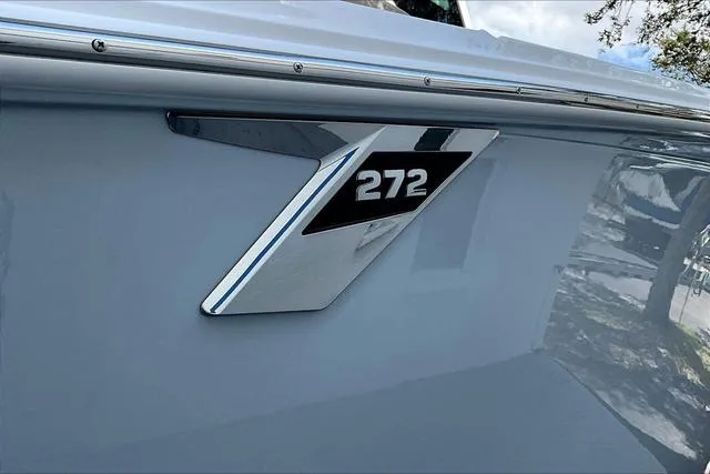 Slide: The Image of 2025 Blackfin 272CC boat emblem on sleek exterior. - 21
