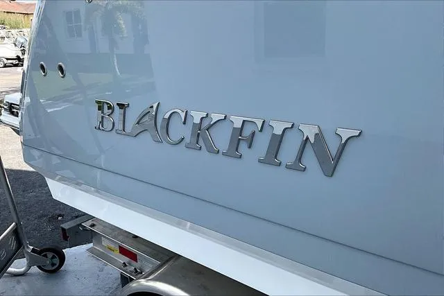 Slide: The Image of 2025 Blackfin 272CC boat with sleek silver logo on the hull. - 22