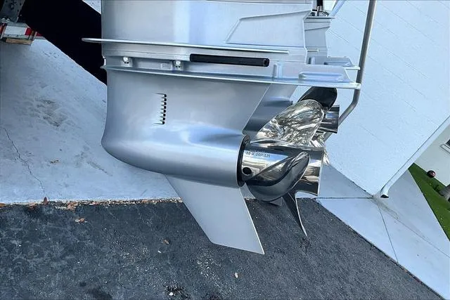 Slide: The Image of Close-up of a 2025 Blackfin 272CC boat propeller and lower unit. - 25