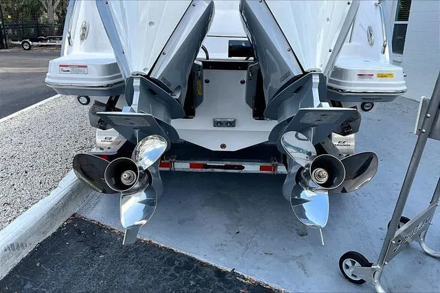 Slide: The Image of 2025 Blackfin 272CC boat with dual outboard engines and shiny propellers. - 26