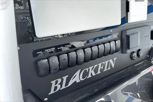Slide: The Image of Control panel of 2025 Blackfin 272CC boat with labeled switches. - 27
