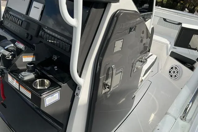 Slide: The Image of 2025 Blackfin 272CC boat interior with sleek control panel and modern design features. - 32
