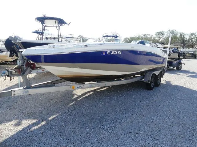 Slide: The Image of 2016 NauticStar 203 DC boat on trailer in a gravel lot. - 1