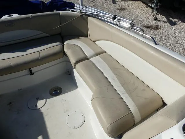 Slide: The Image of Interior seating of 2016 NauticStar 203 DC boat, featuring beige and white upholstery. - 13