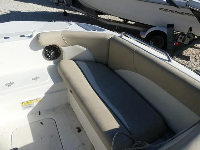 Slide: The Image of 2016 NauticStar 203 DC boat interior with cushioned seating and speaker. - 15