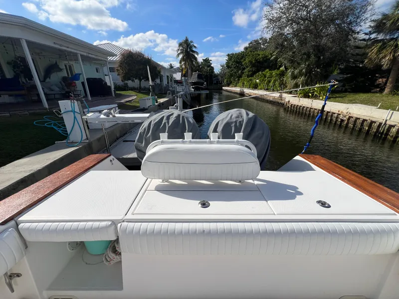 Slide: The Image of 2008 Regulator 32 FS boat docked in a scenic canal setting. - 15