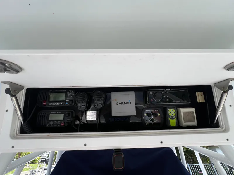 Slide: The Image of 2008 Regulator 32 FS boat electronics panel with Garmin and communication devices. - 17