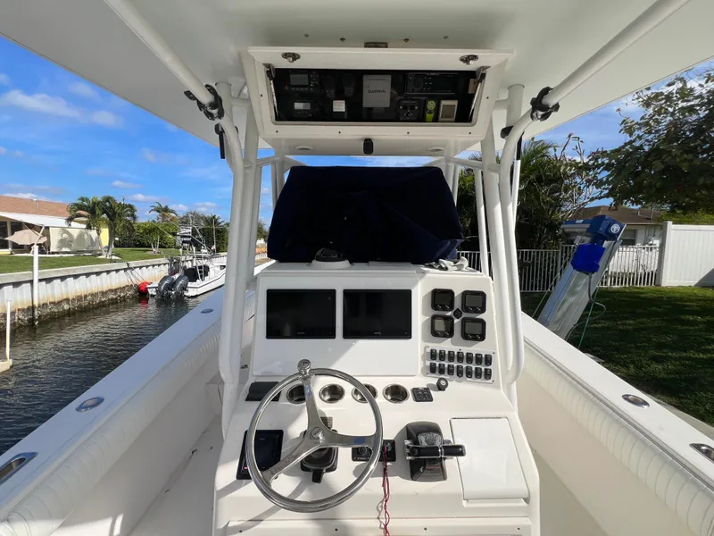 Slide: The Image of 2008 Regulator 32 FS boat console with steering wheel and navigation equipment. - 4