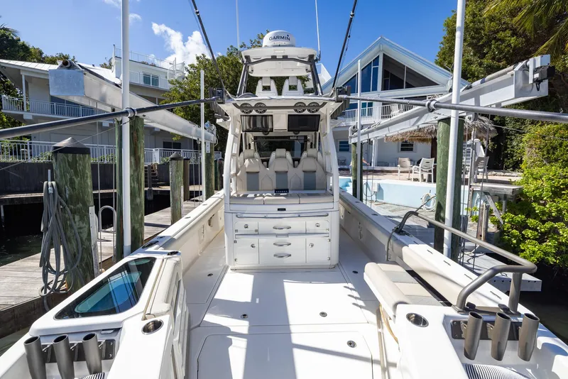 Slide: The Image of 2021 Solace 345 boat docked, showcasing spacious deck and modern design. - 21