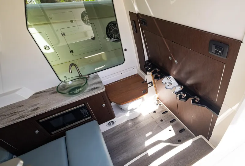 Slide: The Image of Interior of 2021 Solace 345 boat with modern amenities and sleek design. - 24