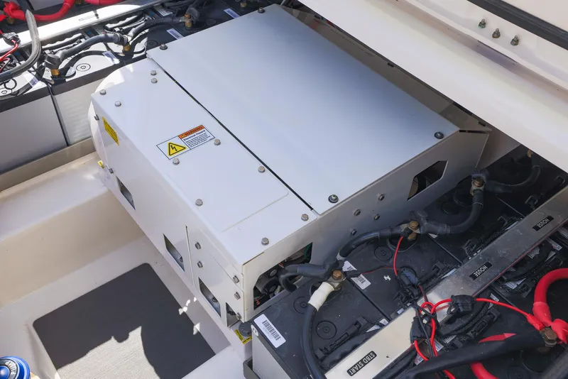 Slide: The Image of Engine compartment of 2021 Solace 345 boat, showcasing electrical components and wiring. - 25