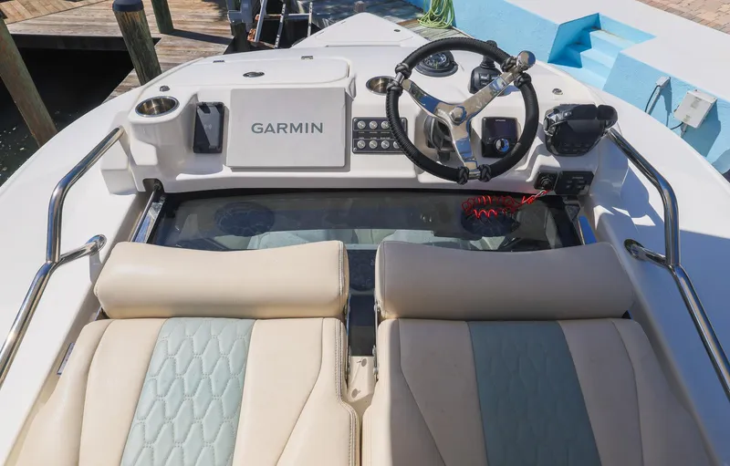 Slide: The Image of 2021 Solace 345 boat cockpit with Garmin navigation system and dual seating. - 30