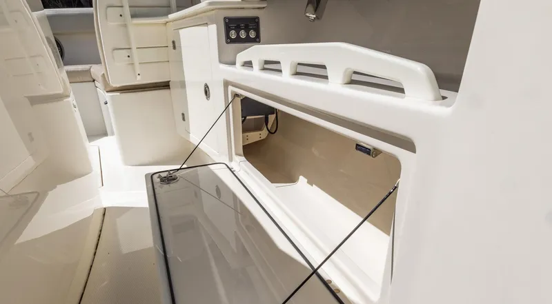 Slide: The Image of 2021 Solace 345 boat storage compartment with open hatch, showcasing interior space. - 33