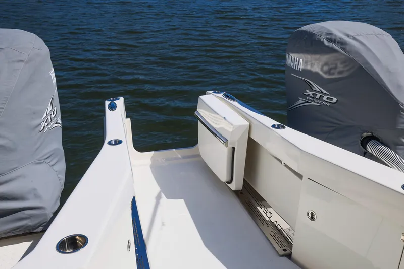 Slide: The Image of 2021 Solace 345 boat deck with Yamaha engines on water. - 34