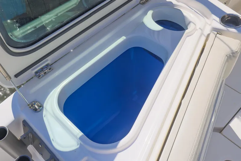 Slide: The Image of Livewell on 2021 Solace 345 boat, featuring a sleek blue interior design. - 38