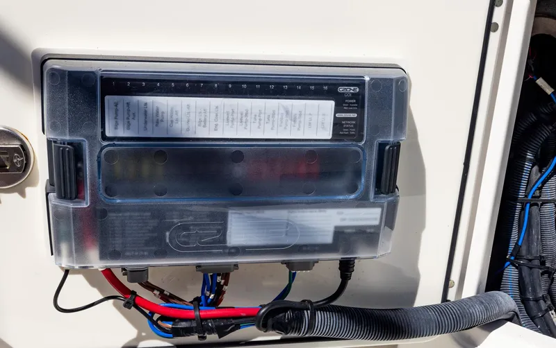 Slide: The Image of Electrical panel on a 2021 Solace 345 boat, featuring wiring and circuit labels. - 43