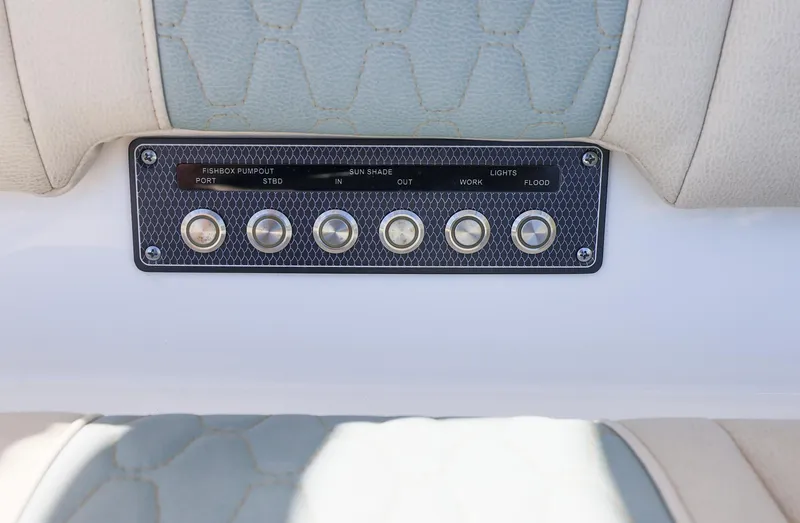 Slide: The Image of Control panel of a 2021 Solace 345 boat with six buttons. - 47